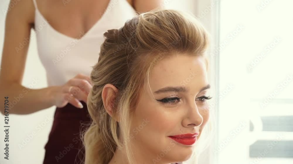 Cheerful client at a reception with a stylist Cheerful client at a reception with a stylist
