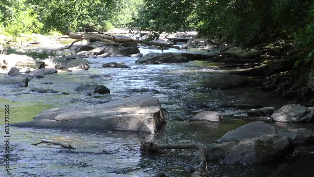 Georgia, Sope Creek, in Summer, A view looking downstream on Sope Creek with rocks and trees Georgia, Sope Creek, in Summer, A view looking downstream on Sope Creek with rocks and trees