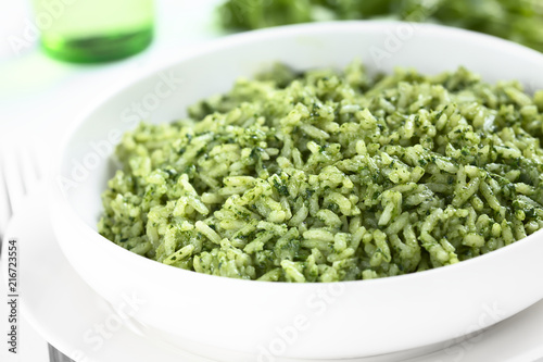 Traditional Mexican Arroz Verde green rice dish made of long-grain rice, spinach, cilantro and garlic (Selective Focus, Focus one third into the rice)
