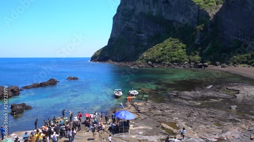 Panorama over jeju diving woman and a volcano on jeju island South korea photo