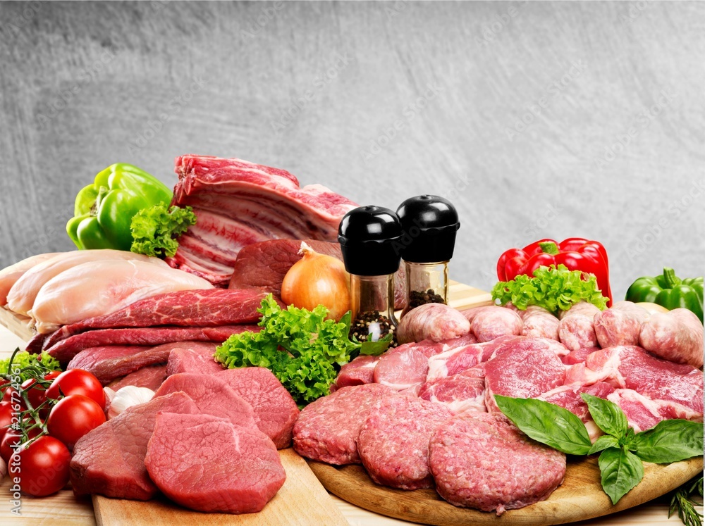 Fresh Raw Meat Background with vegetables Fresh Raw Meat Background with vegetables