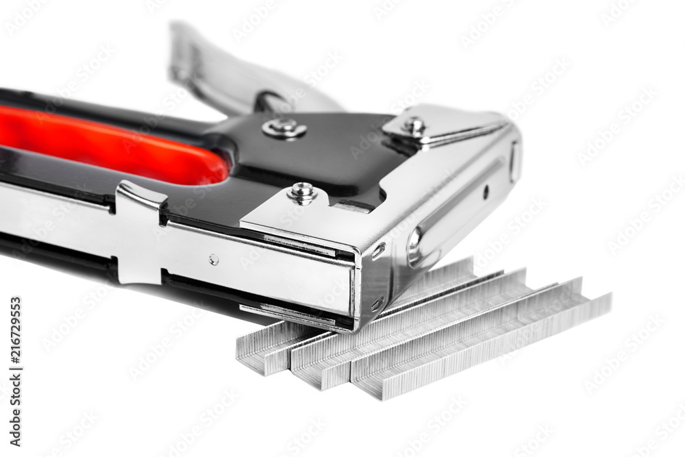 Construction metal stapler and staples on a white background, isolated Construction metal stapler and staples on a white background, isolated