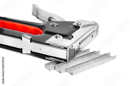 Construction metal stapler and staples on a white background, isolated