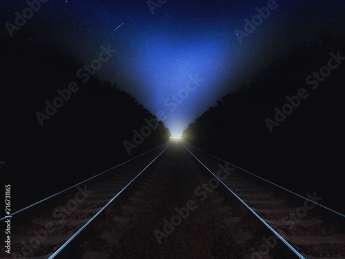 Night railway road closeup goes into the distance on the starry sky background and lights. Night landscape with stars and road