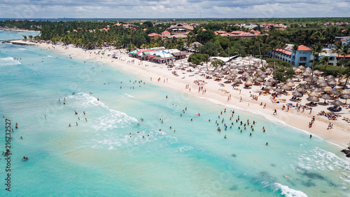 a lot of people on the beach at a resort in the Caribbean. Aerial view