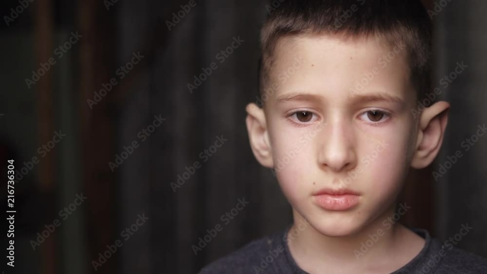 Sad caucasian boy looking at camera. Real authentic emotions. Sad caucasian boy looking at camera. Real authentic emotions.