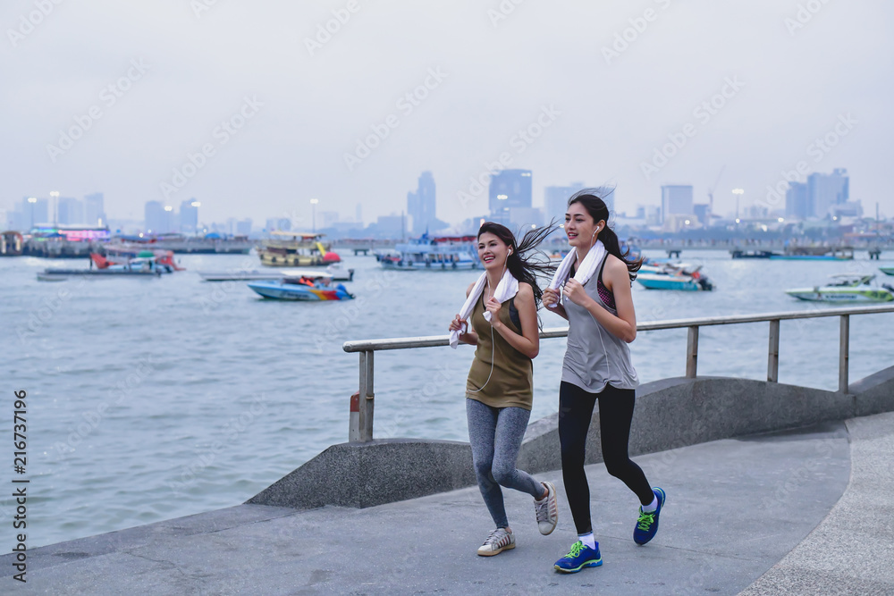 Sports concept. Beautiful girl is exercising on the beach with running. Beautiful girl is happy to exercise. Sports concept. Beautiful girl is exercising on the beach with running. Beautiful girl is happy to exercise.