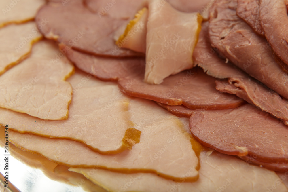 Sausage cuts of different varieties on a plate. Sausage cuts of different varieties on a plate.