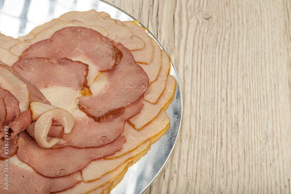 Sausage cuts of different varieties on a plate. Sausage cuts of different varieties on a plate.