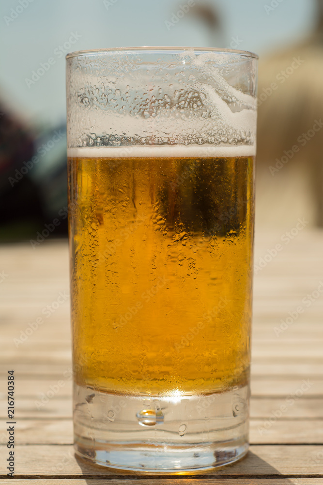 cold fresh beer on summer at the beach cold fresh beer on summer at the beach