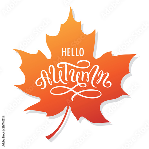 Hello autumn lettering on a maple leaf.