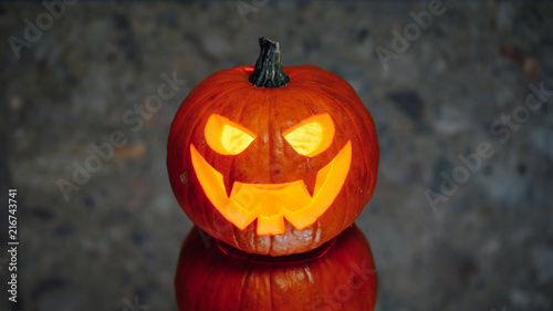 jack-o-lantern pumpkin candle light, gray background