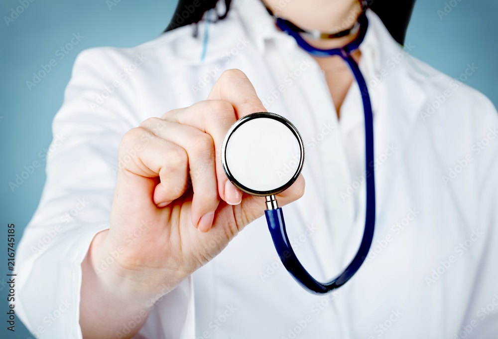 Doctor holding stethoscope Doctor holding stethoscope