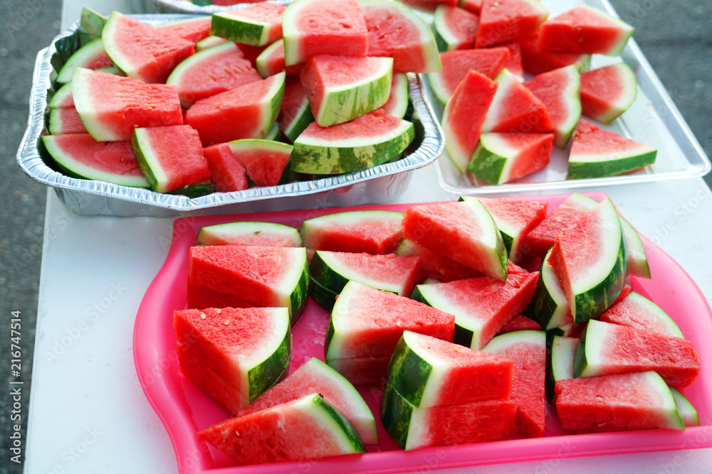  watermelon cut in pieces in the container for the event