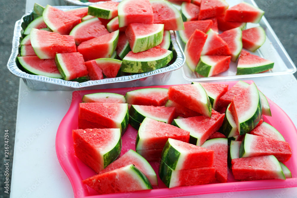 watermelon cut in pieces in the container for the event watermelon cut in pieces in the container for the event