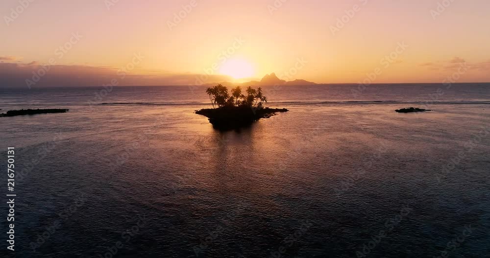 small island in the middle of a lagoon in aerial view with a splendid sunset, dream vacation small island in the middle of a lagoon in aerial view with a splendid sunset, dream vacation