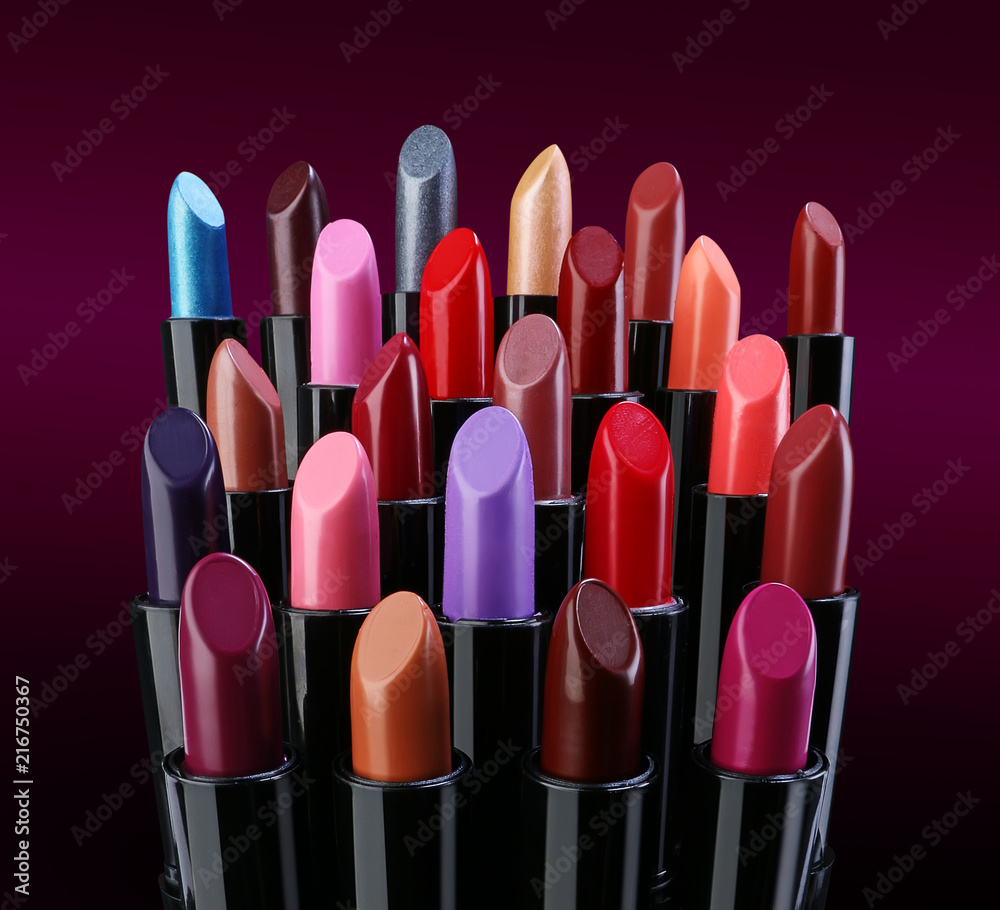 Obraz premium Group of various fashion lipsticks over dark background