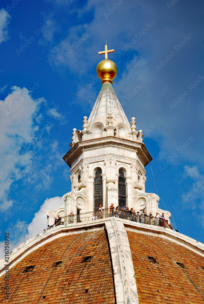 Detail, Brunelleschi's Dome, Florence Italy, with sightseers congregated at the top of the dome.