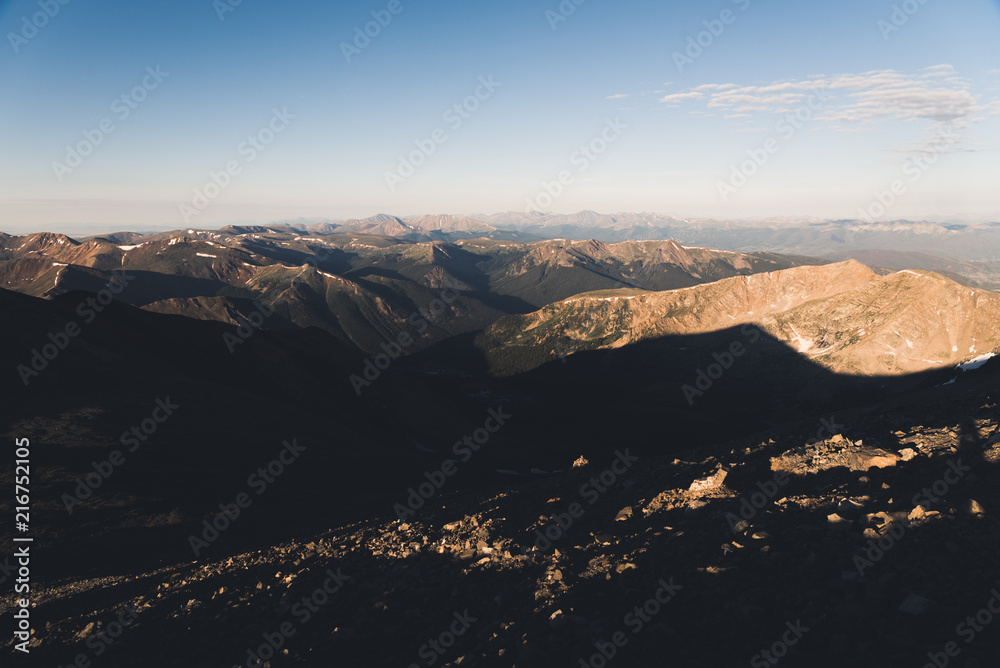 Scenic view of the Rocky Mountains from the top of a mountain in Colorado. 