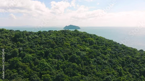 Flies from behid island with view of another island. Fly over island and sea. Uninhabited island. Thailand photo