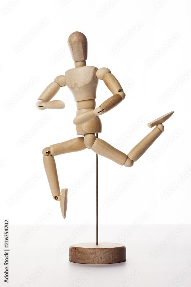 Wooden Dummy human jump isolated white. Wooden Dummy human jump isolated white.