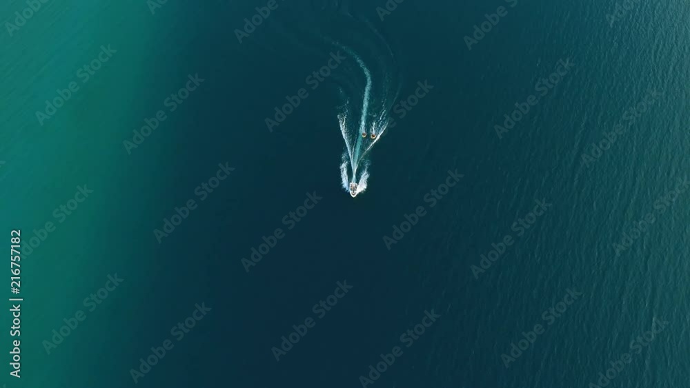 Boat towing water tubes on Torch Lake in northern Michigan Boat towing water tubes on Torch Lake in northern Michigan