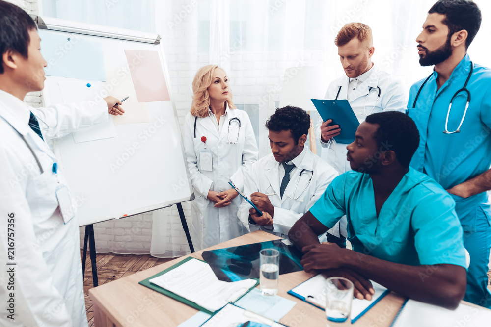 Fototapeta premium Teamwork Medical Consultation With Head Doctor.