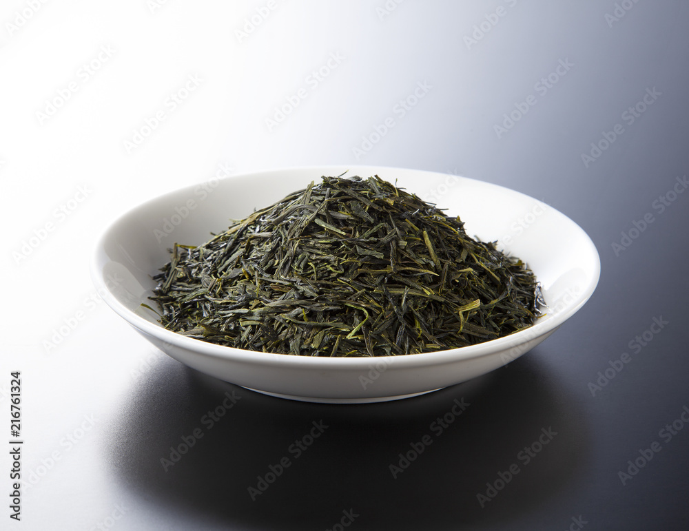 green tea leaves isolated on black background green tea leaves isolated on black background