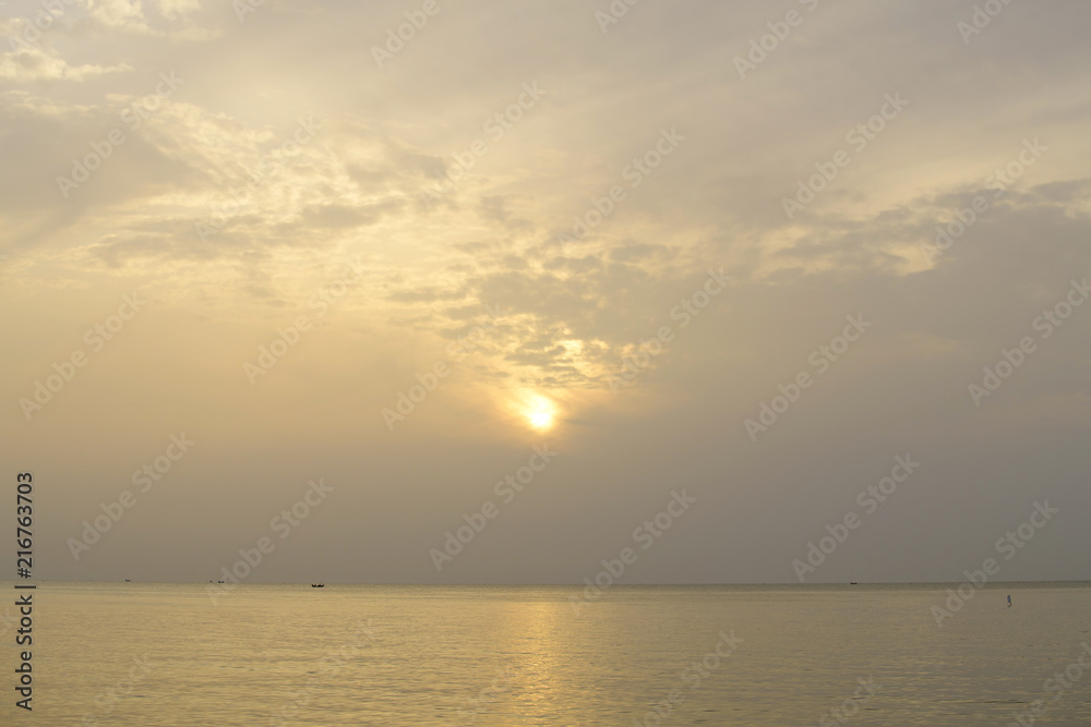 Sunrise in sea the morning  amidst the clouds and the sky is beautiful quiet atmosphere feeling lonely