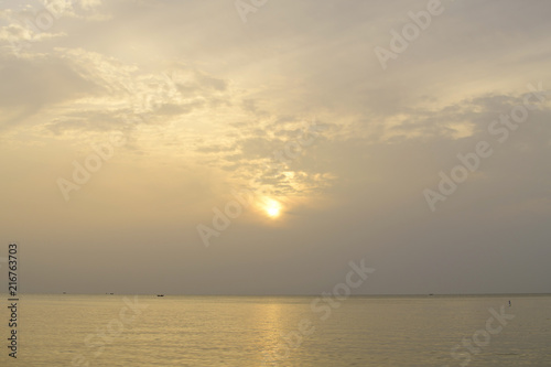 Sunrise in sea the morning  amidst the clouds and the sky is beautiful quiet atmosphere feeling lonely © pcbang