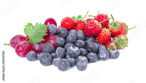Mix berries isolated on a white. Ripe blueberries, currants and strawberries with mint.