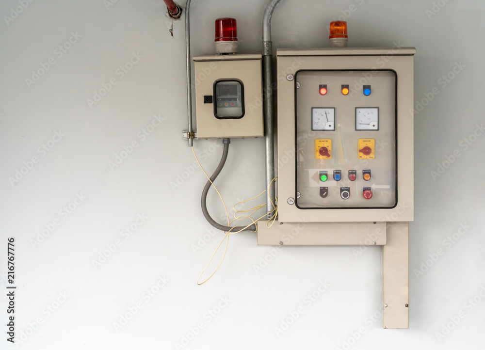 Electric city control panel in grey metal box hanging on wall. Electric city control panel in grey metal box hanging on wall.