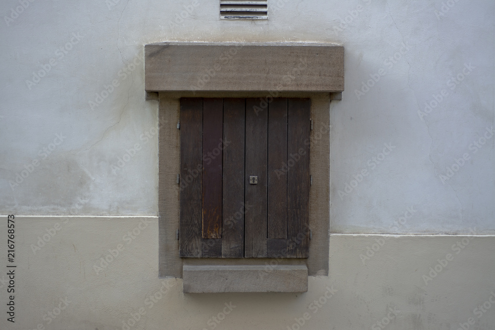 Fototapeta premium Small wooden door in the wall