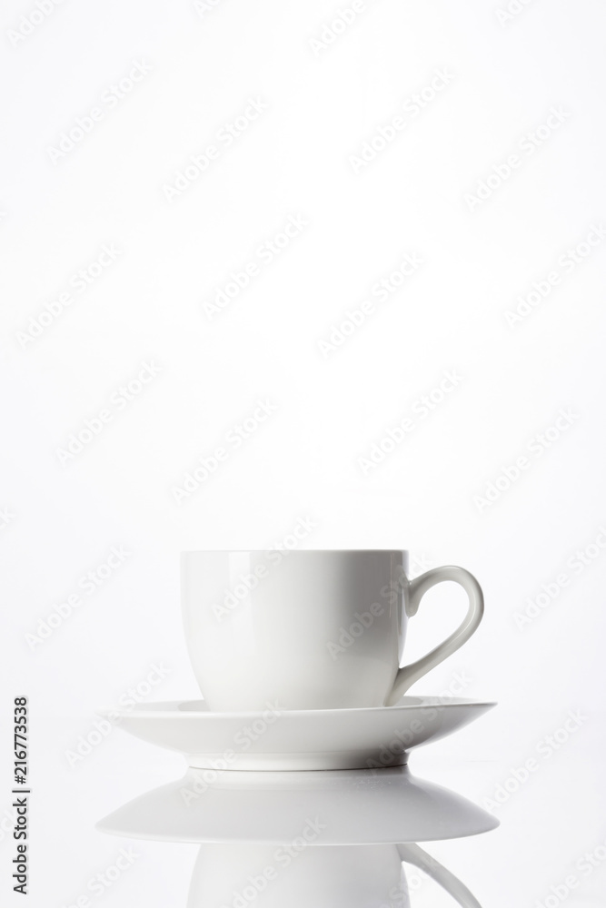 Fototapeta premium white coffee cup with saucer isolated white.
