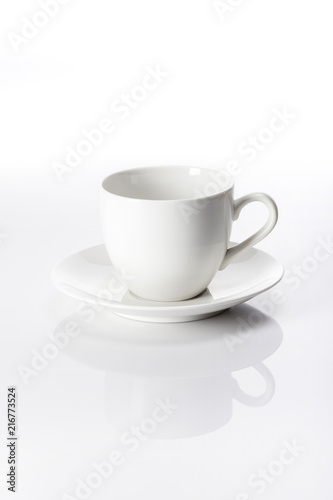white coffee cup with saucer isolated white.