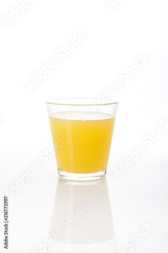 orange juice with a glass cup isolated white.