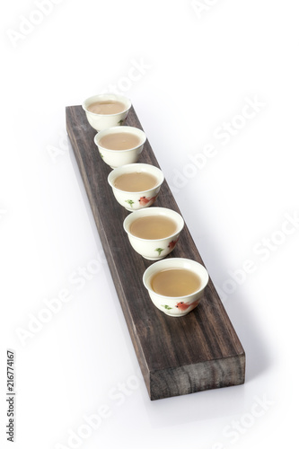 chinese per tea with many cup isolated white.