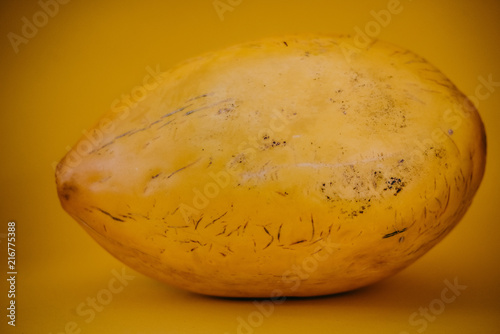 Yellow canary melon on the yellow background photo