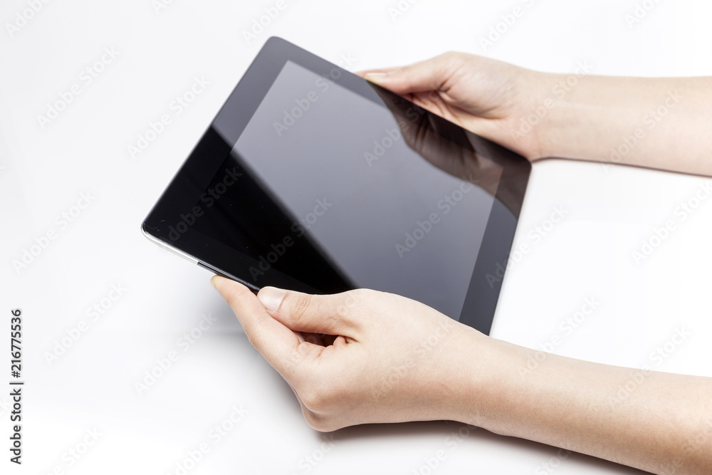 woman hand hold a tablet pc isolated white. woman hand hold a tablet pc isolated white.