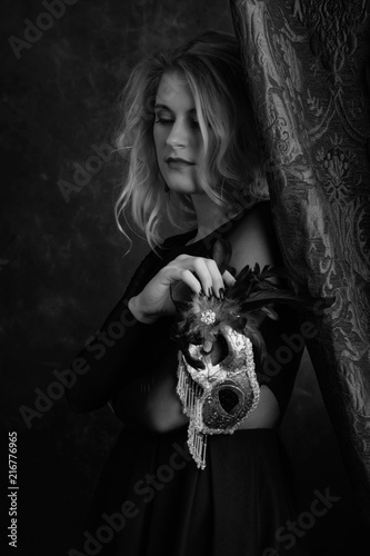 Portrait of beautiful woman with carnival mask.