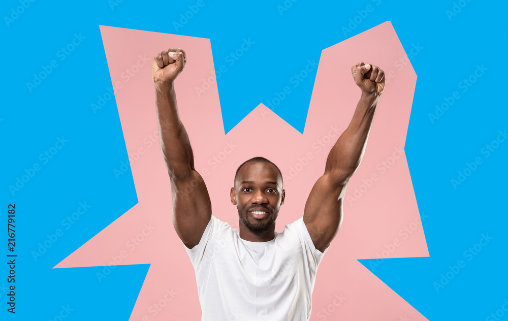 I won. Winning success happy man celebrating being a winner. Dynamic image of afro male model on green studio background. Victory, delight concept. Human facial emotions concept. Trendy colors I won. Winning success happy man celebrating being a winner. Dynamic image of afro male model on green studio background. Victory, delight concept. Human facial emotions concept. Trendy colors