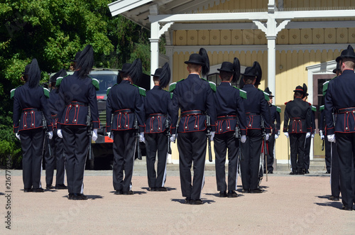 Norwegian soldiers in gala uniforms changing honor guard in front of the Royal Palace 