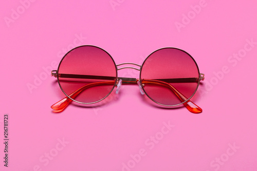 Beautiful trendly sunglasses on a pink background