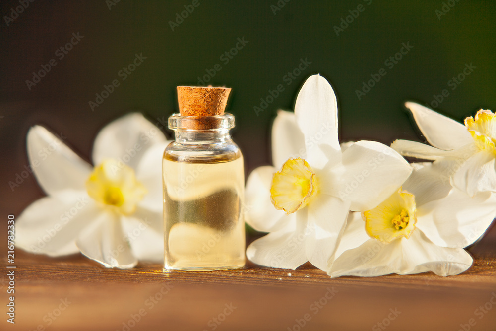 Essence of flowers on table in beautiful glass jar Essence of flowers on table in beautiful glass jar