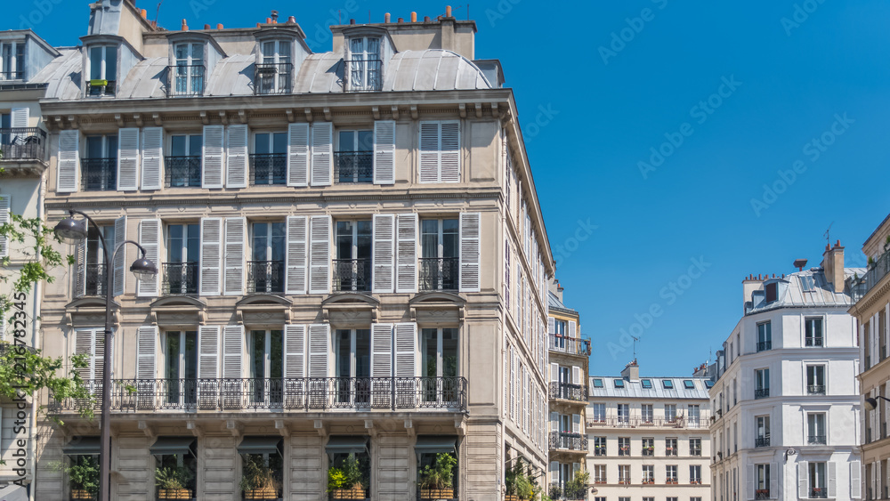 Paris, beautiful building, typical parisian facade in the Marais 
