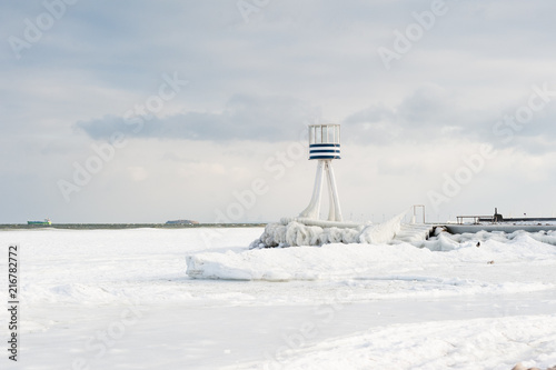 Frozen Winter Beach Life Guard Tower In Sunshine And Ice