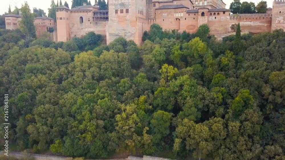 Spain castle Alhambra located on the hill. Palace and fortress complex located in Granada, Andalusia. aerial video footage from drone. the camera rises from the bottom up. Spain castle Alhambra located on the hill. Palace and fortress complex located in Granada, Andalusia. aerial video footage from drone. the camera rises from the bottom up.