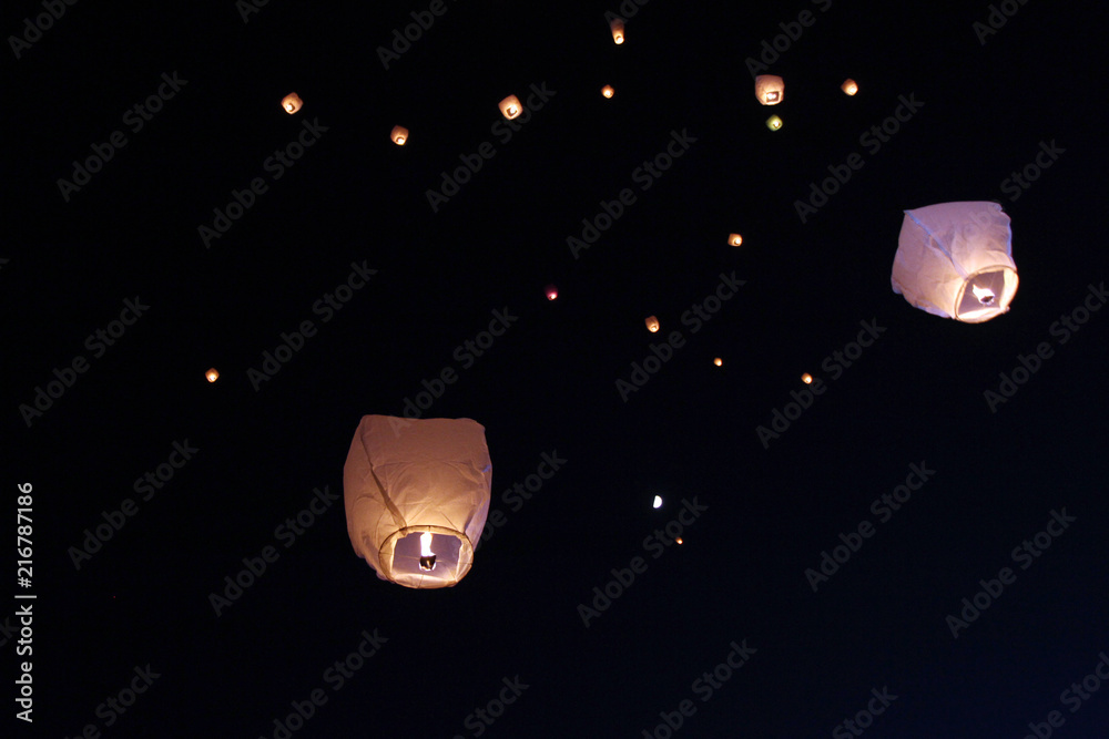 Sky lanterns floating in the sky. Deepavali lights festival. Chinese sky  lantern wallpaper. Diwali celebration – the festivals of the light. A Hindu  festival of lights and people releasing sky lantern Stock