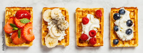 Traditional belgian waffles with whipped cream and fresh fruits  photo