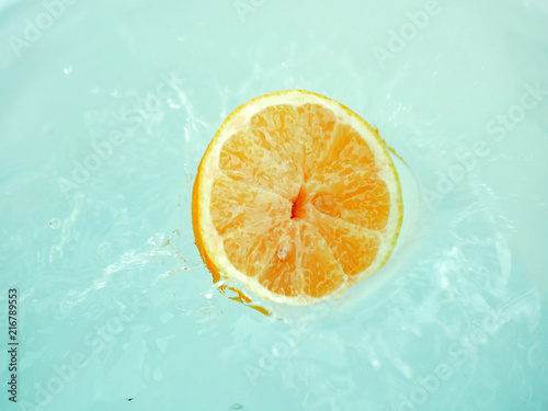 Polonne / Ukraine - 01 August 2018: the lemon falls into the water
